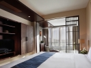 Кровать или кровати в номере Serenity Coast All Suite Resort Sanya