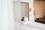 Кровать или кровати в номере Hotel Trofana Alpin