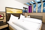 Кровать или кровати в номере Astellina hotel-apart