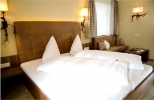 Кровать или кровати в номере Hotel Garni Caroline