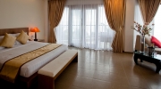 Кровать или кровати в номере Unique Mui Ne Resort and Spa