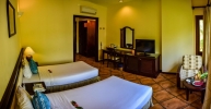 Кровать или кровати в номере Pandanus Resort