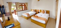 Кровать или кровати в номере Little Muine Cottages Resort