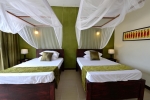 Кровать или кровати в номере Amaan Beach Bungalows