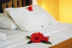Кровать или кровати в номере Coral Reef Resort