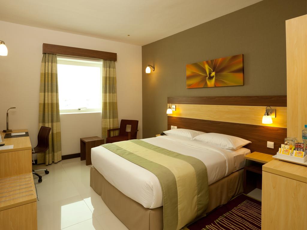 Отель Кровать или кровати в номере Citymax Sharjah