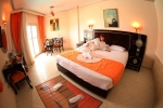 Кровать или кровати в номере Sphinx Aqua Park Beach Resort