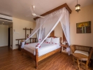 Кровать или кровати в номере DoubleTree Resort by Hilton Zanzibar - Nungwi