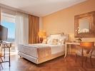 Кровать или кровати в номере Grecotel Creta Palace