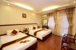 Кровать или кровати в номере Luxury Nha Trang Hotel