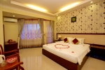 Кровать или кровати в номере Luxury Nha Trang Hotel