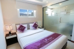 Кровать или кровати в номере Lavender Nha Trang Hotel