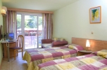 Кровать или кровати в номере Hotel Magnolia All Inclusive