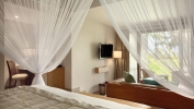Кровать или кровати в номере Kempinski Seychelles Resort