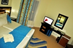 Кровать или кровати в номере Nubian Village Aqua Hotel