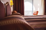 Кровать или кровати в номере Domina Oasis Hotel & Resort