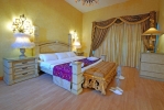 Кровать или кровати в номере Nubian Island Hotel