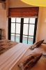 Кровать или кровати в номере Hibiscus Beach Hotel & Villas