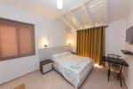 Кровать или кровати в номере Hotel Mariksel
