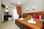 Кровать или кровати в номере Hotel Olympus