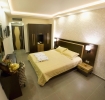 Кровать или кровати в номере Dion Hotel