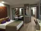 Кровать или кровати в номере Delphin BE Grand Resort