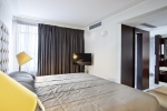 Кровать или кровати в номере Kontokali Bay Resort & Spa
