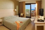 Кровать или кровати в номере Cactus Royal