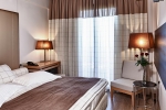 Кровать или кровати в номере Olympus Thea Hotel