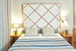 Кровать или кровати в номере Olympus Thea Hotel
