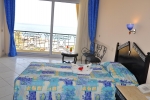 Кровать или кровати в номере King Tut Aqua Park Beach Resort