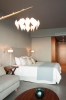 Кровать или кровати в номере Sensimar Elounda Village Resort & Spa by Aquila