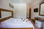Кровать или кровати в номере Club Pink Palace Hotel