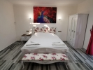 Кровать или кровати в номере Club Pink Palace Hotel