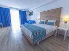 Кровать или кровати в номере Garcia Resort & Spa - Ultra All Inclusive