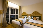 Кровать или кровати в номере Green World Hotel Nha Trang