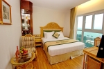 Кровать или кровати в номере Green World Hotel Nha Trang