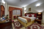 Кровать или кровати в номере Comfort Inn Hotel Deira