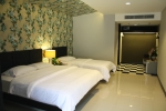 Кровать или кровати в номере Pattaya Garden