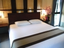 Кровать или кровати в номере Pattaya Garden