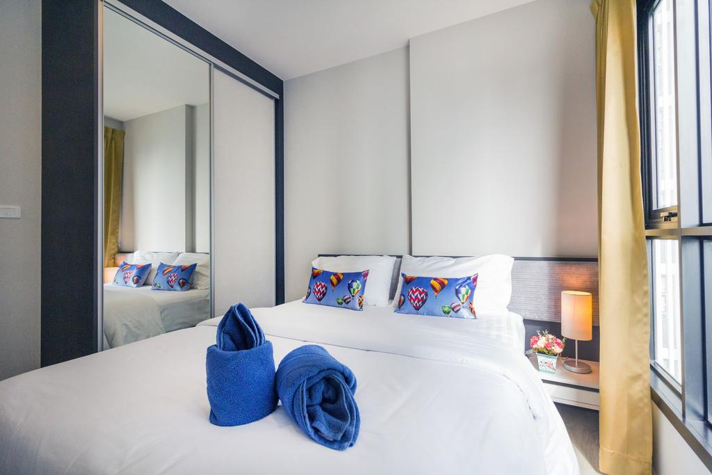 Отель Кровать или кровати в номере The Cozy@The Base Pattaya 