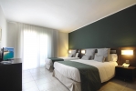 Кровать или кровати в номере Aqua Hotel Bertran Park