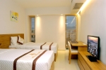 Кровать или кровати в номере Golden Holiday Hotel