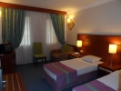 Кровать или кровати в номере Aegean Park Hotel