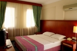 Кровать или кровати в номере Aegean Park Hotel
