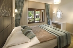 Кровать или кровати в номере Kustur Club Holiday Village - All Inclusive