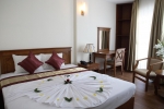 Кровать или кровати в номере Viet Sky Hotel