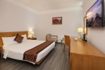 Кровать или кровати в номере Prime Hotel
