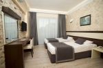 Кровать или кровати в номере Camyuva Beach Hotel