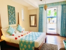 Кровать или кровати в номере Thaproban Beach House